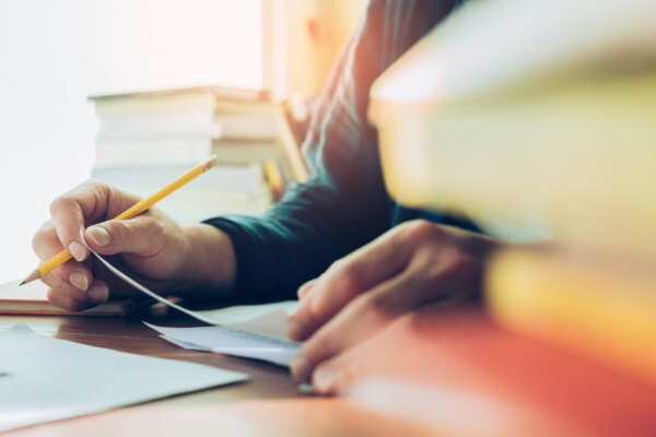 high school,university student study.hands holding pencil writing paper answer sheet.sitting lecture chair taking final exam attending in examination classroom.concept scholarship for education abroad high school,university student study.hands holding pencil writing paper answer sheet.sitting lecture chair taking final exam attending in examination classroom.concept scholarship for education abroad
